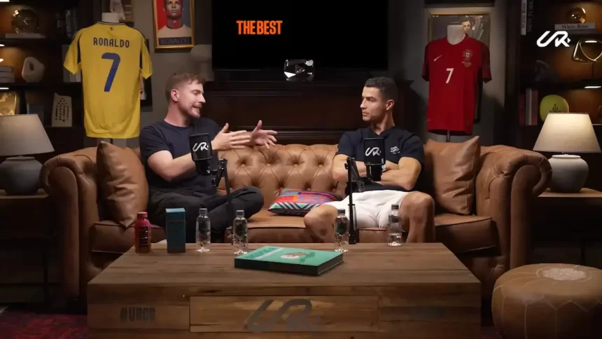 Cristiano Ronaldo and MrBeast in a candid discussion on a leather couch, sharing insights on digital media and global influence.