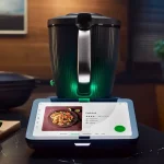 Thermomix TM7 showing a Pad Thai recipe on its touchscreen, on a kitchen countertop.